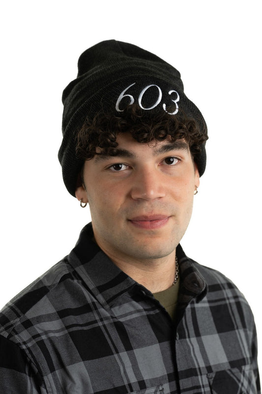 Young man wearing 603 classic cuff beanie Live Free, a cozy essential perfect for cold weather