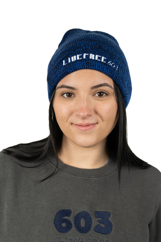 Model wearing navy 603 Live Free cozy beanie with embroidered 603 Live Free logo design