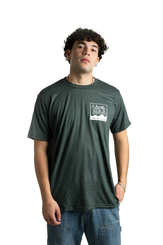 Young man wearing dark green Live Free Roam Wild stamp t-shirt with front graphic design