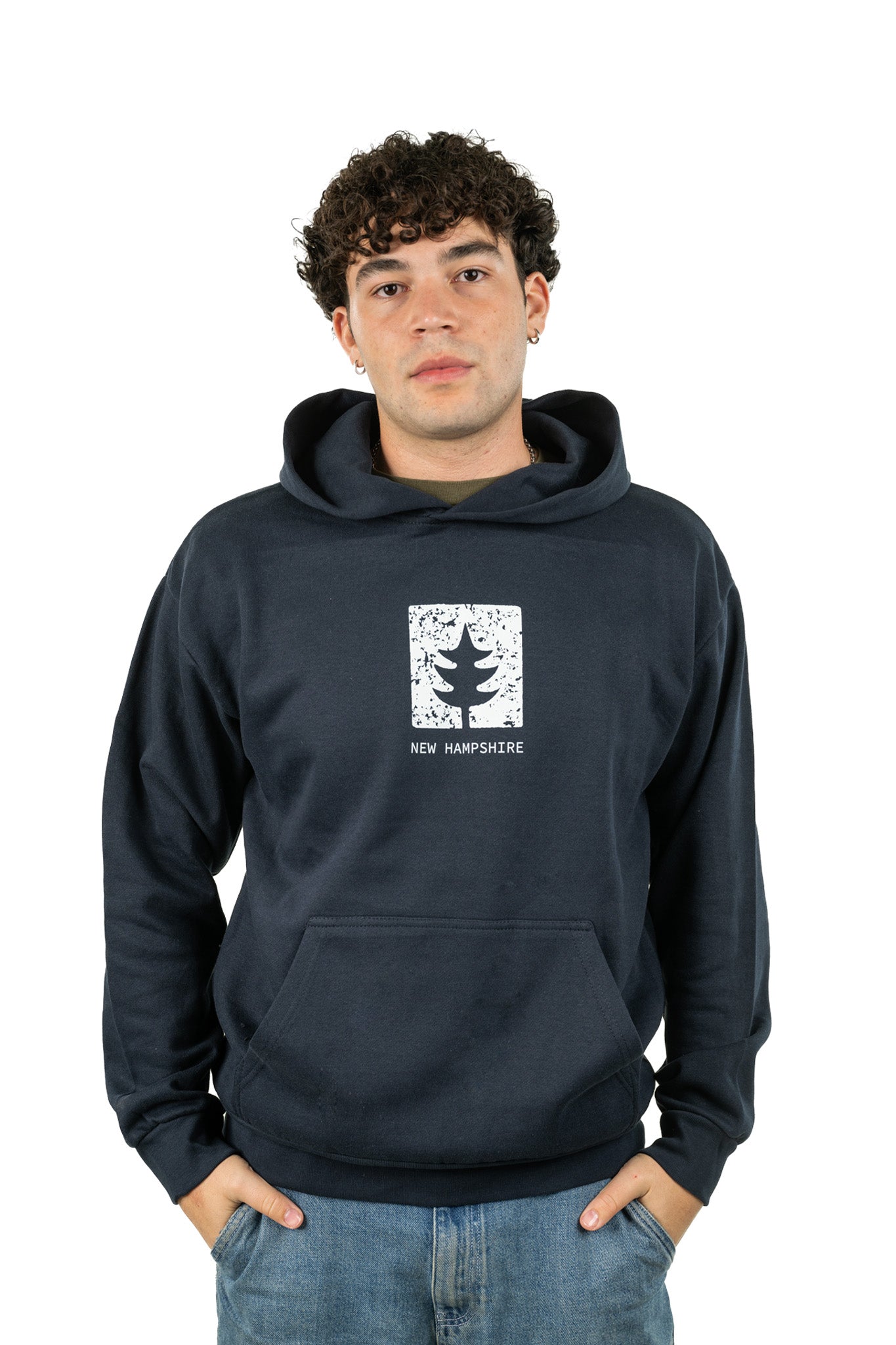 Young man in New Hampshire unisex oversized graphic hoodie featuring tree stamp design