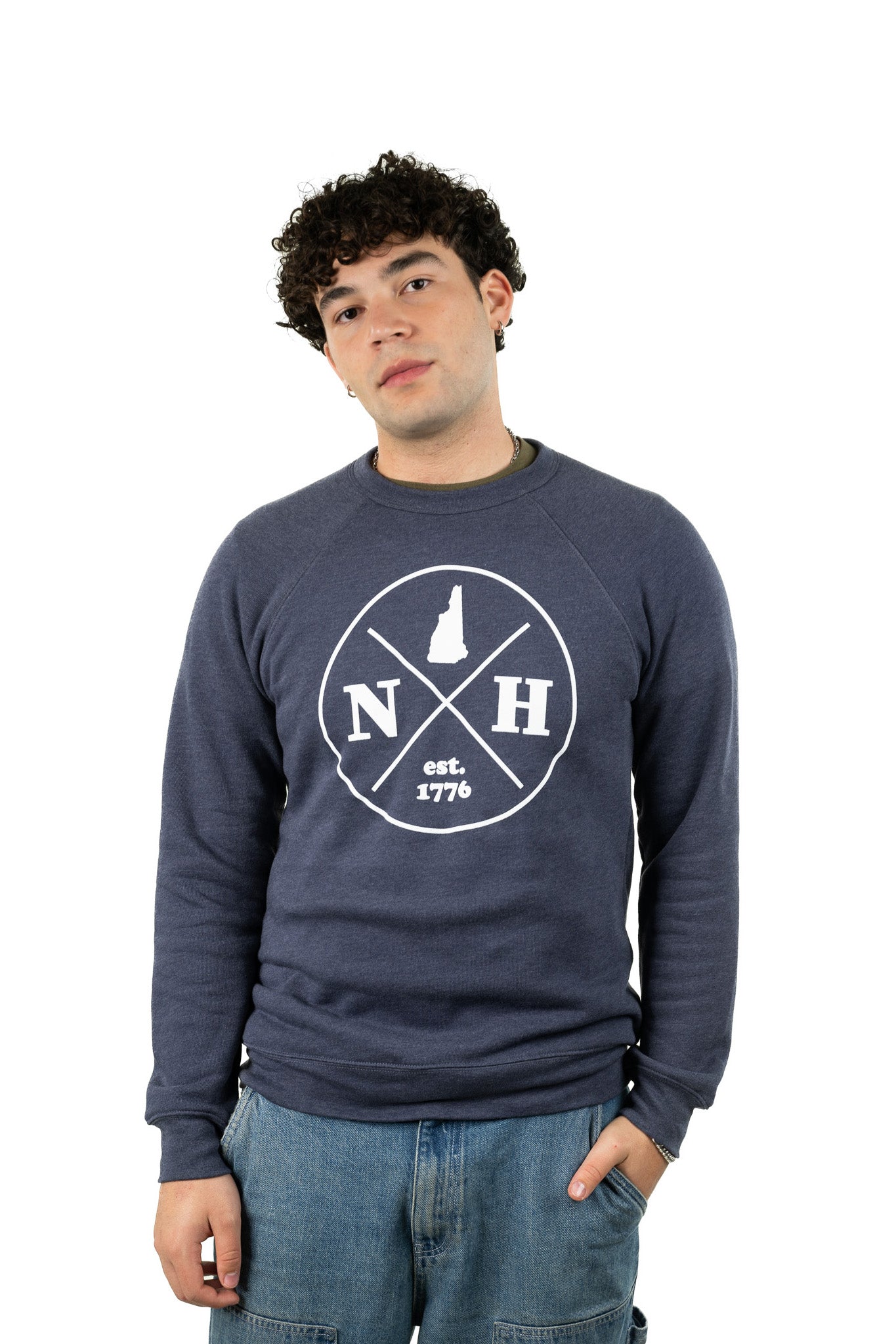 Young man in unisex NH sweatshirt with loose fit and bold graphic design for a relaxed streetwear look
