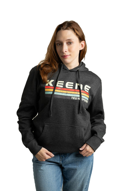 Model wearing Keene NH unisex hoodie with colorful graphic design and relaxed streetwear fit