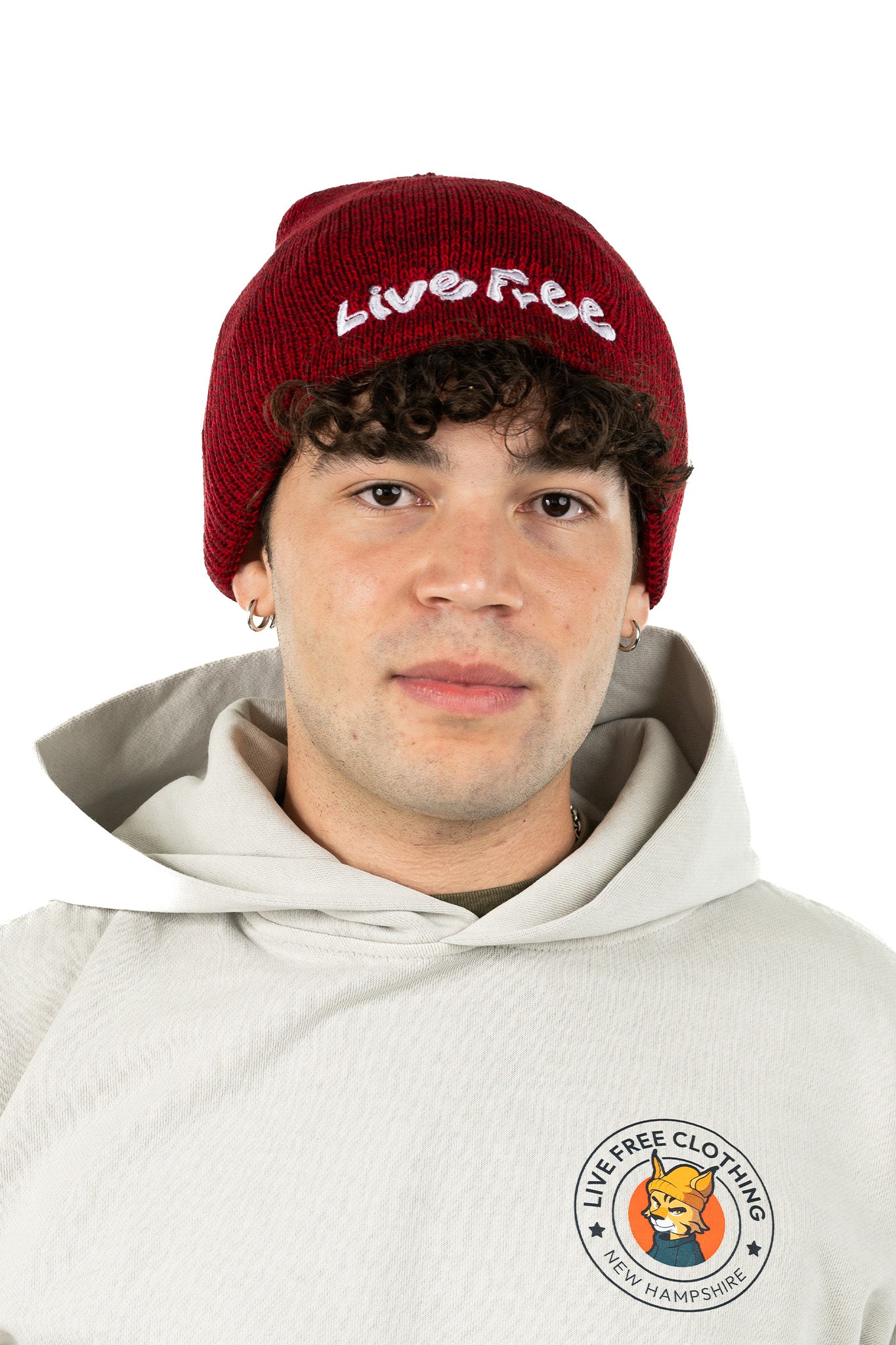 Model wearing soft, cozy red Live Free classic beanie designed for warmth and winter comfort