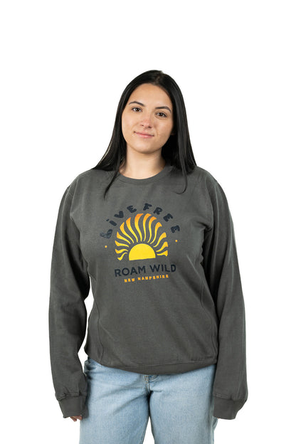 Young woman wearing dark gray Roam Wild crewneck with New Hampshire-inspired graphic stamp