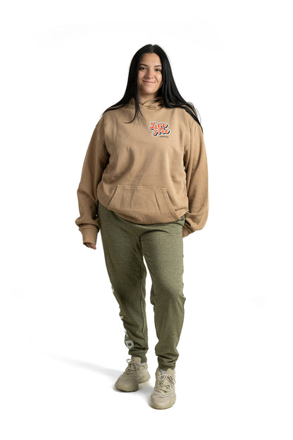 Model wearing military green Unisex Roam Wild sweatpants jogger with leg and pocket graphic designs