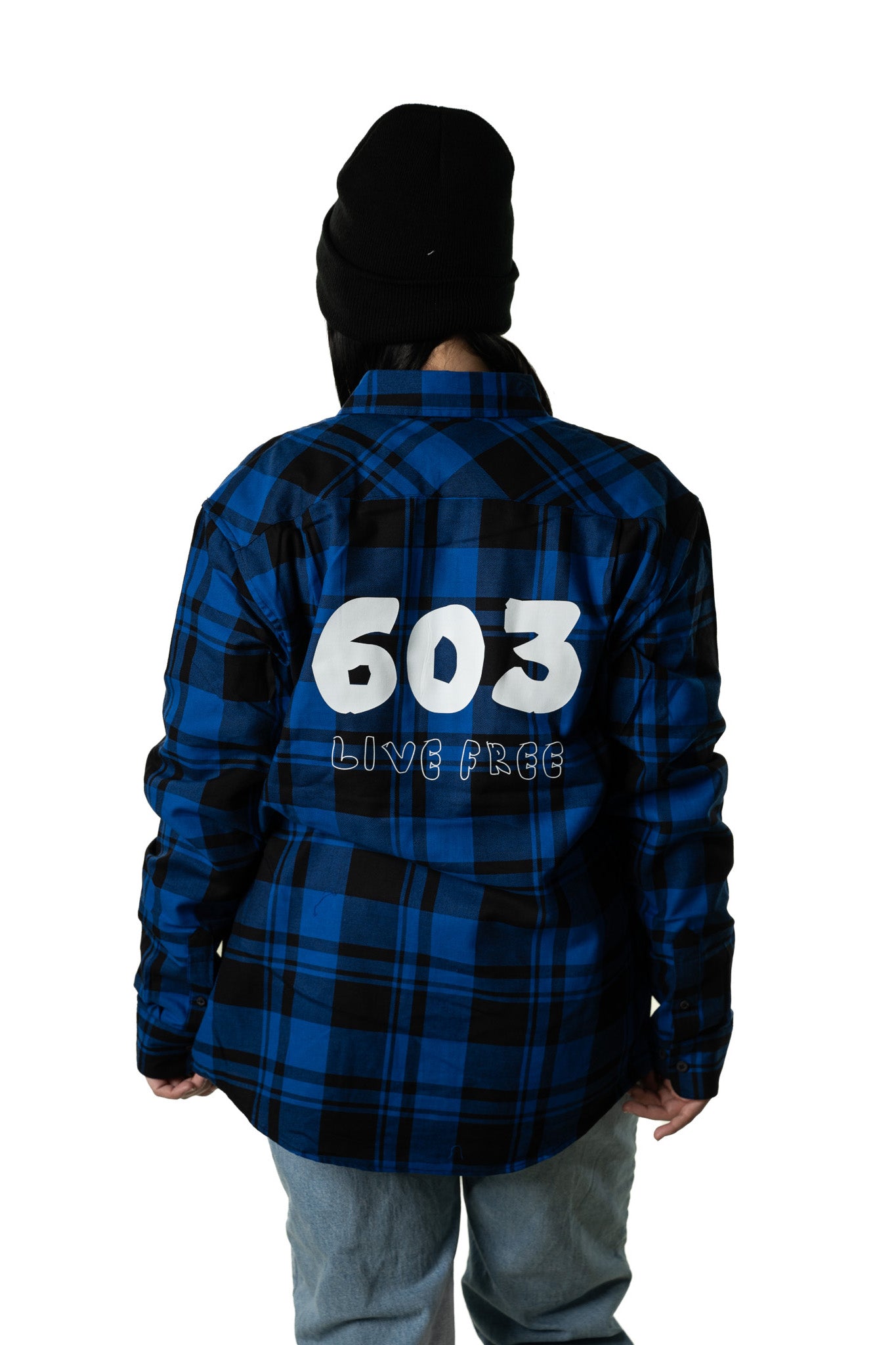 Woman wearing blue unisex 603 Live Free plaid shirt featuring bold back graphic design