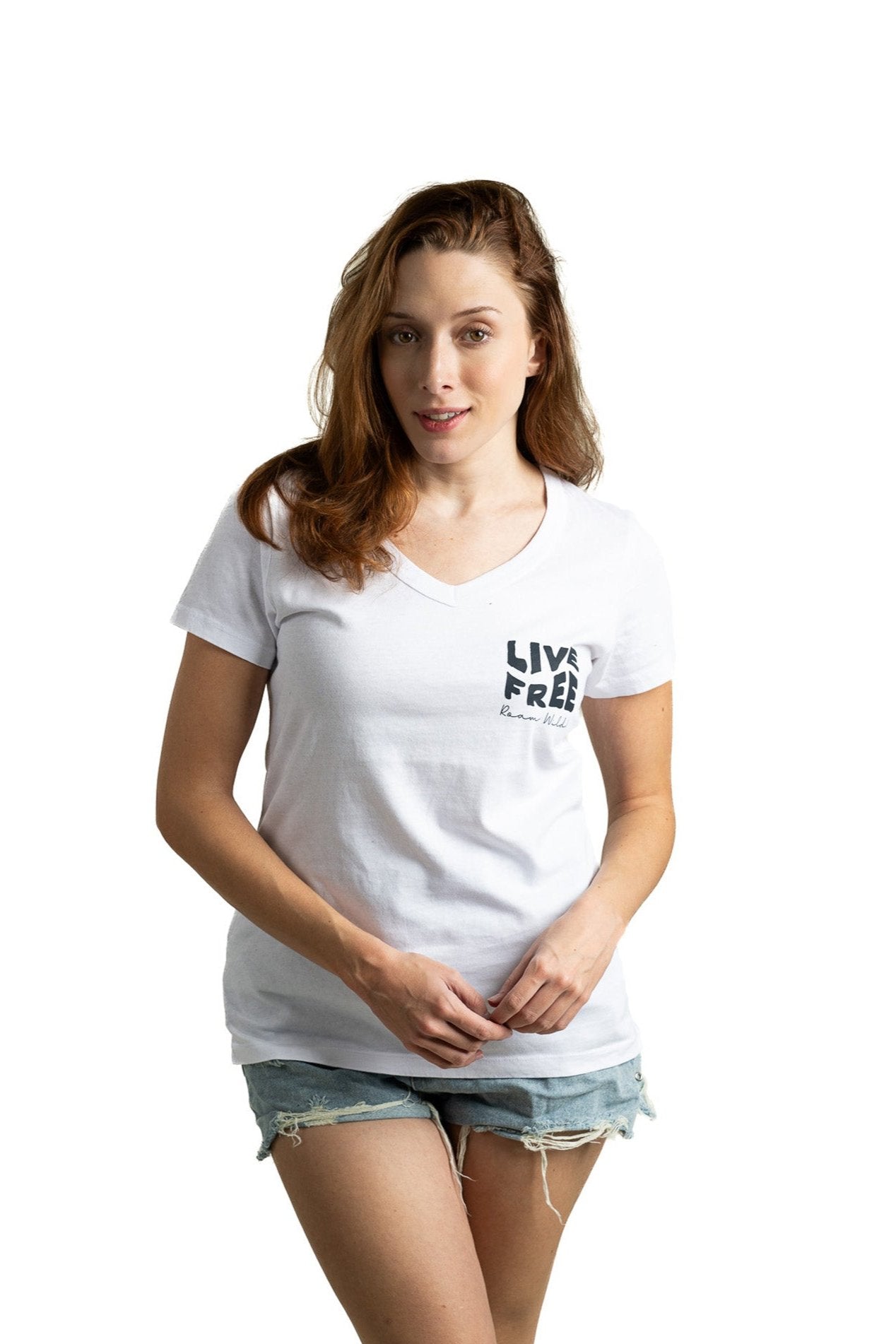 Model in white women's classic Live Free logo tee with V-neck and vintage-inspired style